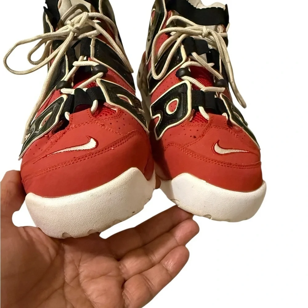 This is a pair of Nike Air More Uptempo '96 basketball shoes in a red, black.